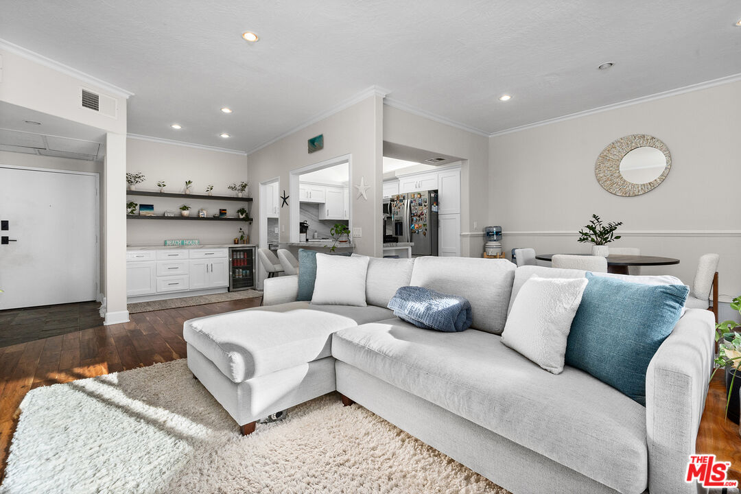 8160 Manitoba Street, Unit 101 Playa del Rey, CA 90293 - Photo 1 of 20 a living room with furniture and a flat screen tv