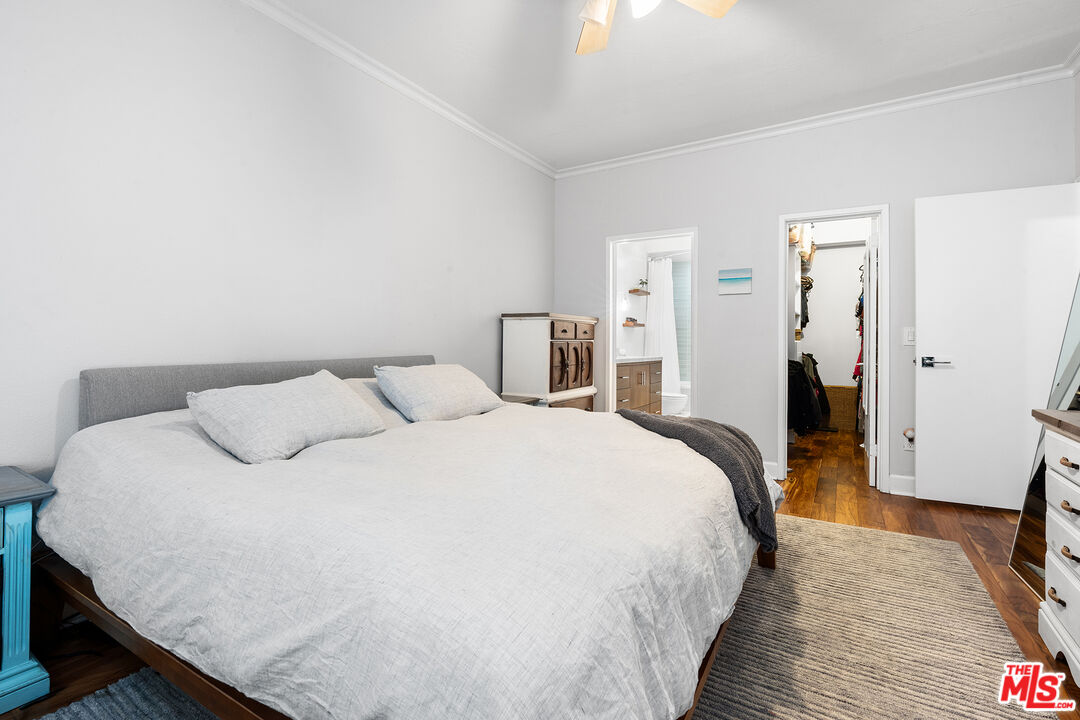 8160 Manitoba Street, Unit 101 Playa del Rey, CA 90293 - Photo 11 of 20 a bedroom with a bed and wooden floor