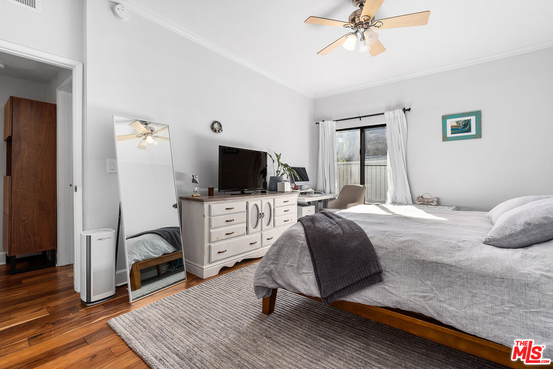 8160 Manitoba Street, Unit 101 Playa del Rey, CA 90293 - Photo 12 of 20 a bedroom with furniture and a flat screen tv