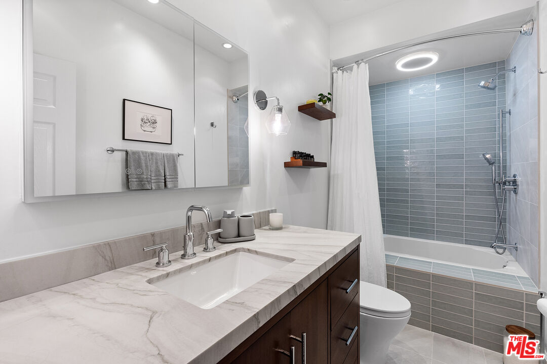 8160 Manitoba Street, Unit 101 Playa del Rey, CA 90293 - Photo 14 of 20 a bathroom with a sink a toilet and shower