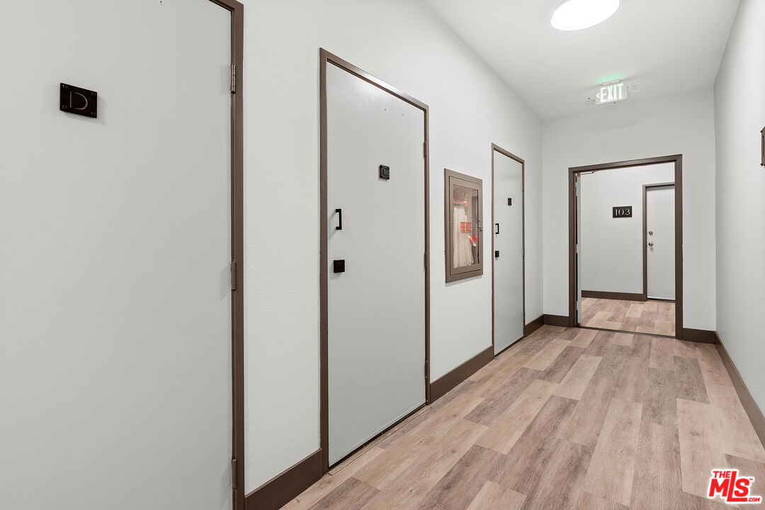 8160 Manitoba Street, Unit 101 Playa del Rey, CA 90293 - Photo 17 of 20 a view of a hallway with wooden floor