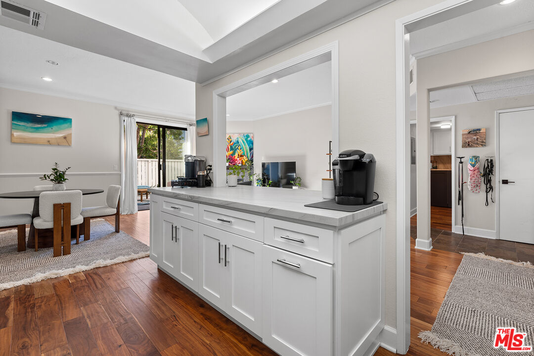 8160 Manitoba Street, Unit 101 Playa del Rey, CA 90293 - Photo 8 of 20 a kitchen with white cabinets and sink