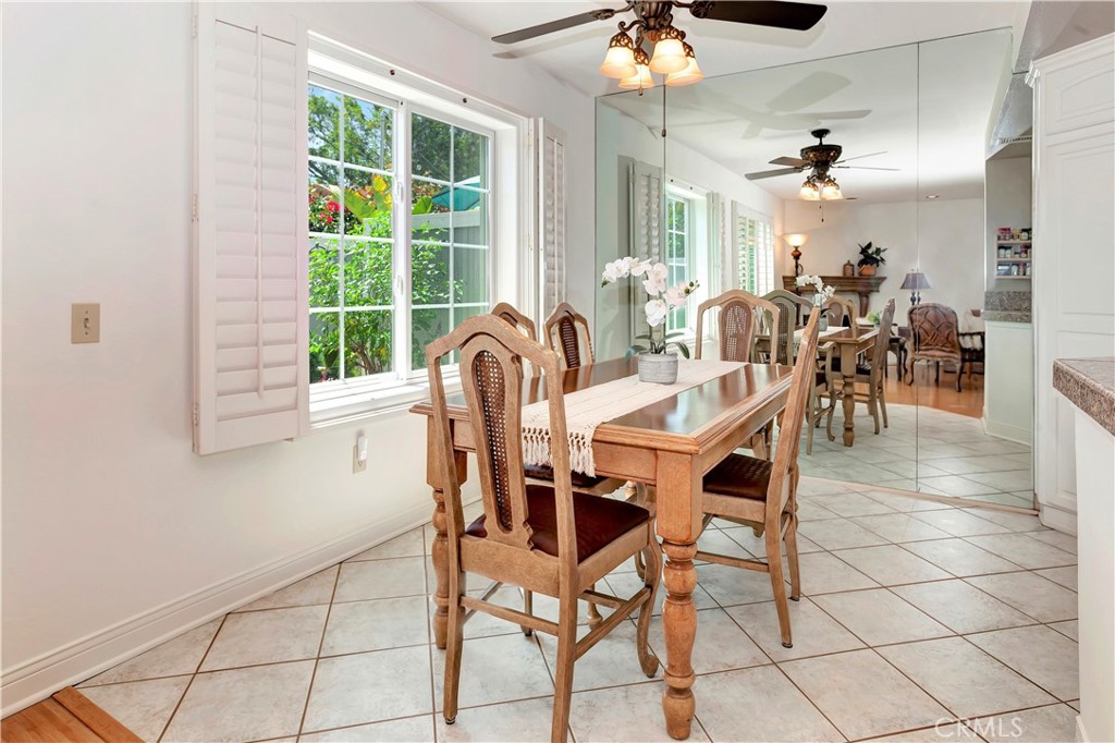 2523 Back Bay Loop, Unit 45 Costa Mesa, CA 92627 - Photo 11 of 26 Dining room with new Anderson windows, plantation shutters, ceramic flooring, ceiling fan
