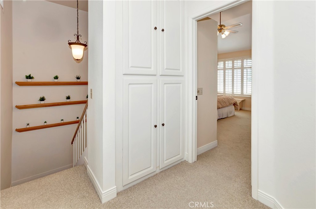 2523 Back Bay Loop, Unit 45 Costa Mesa, CA 92627 - Photo 13 of 26 Upstairs Landing with additional storage in hallway