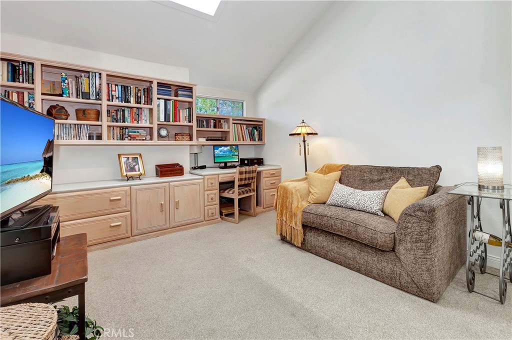 2523 Back Bay Loop, Unit 45 Costa Mesa, CA 92627 - Photo 18 of 26 Third Bedroom currently used as Den/Office. This spacious room has built in desk and bookcase with custom skiylight above. Abundant natural light! Ensuite bath.