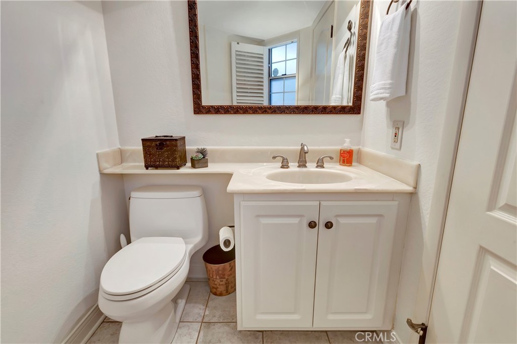 2523 Back Bay Loop, Unit 45 Costa Mesa, CA 92627 - Photo 22 of 26 Light, newly painted Powder Room with privacy window and plantation shutter