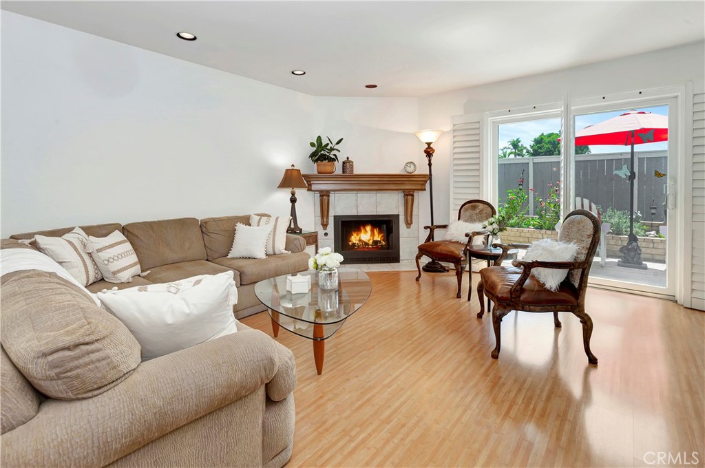 2523 Back Bay Loop, Unit 45 Costa Mesa, CA 92627 - Photo 7 of 26 First floor Living Room with Fireplace and new Anderson Sliders onto patio