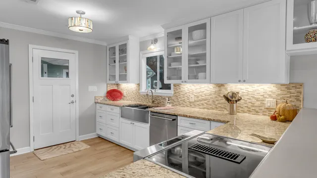 a living room with granite countertop furniture and a fireplace