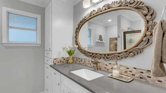 a bathroom with a sink and a mirror