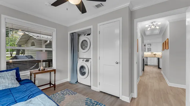 a view of a hallway with washer and dryer