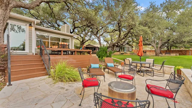 a wooden bench sitting in front of a building