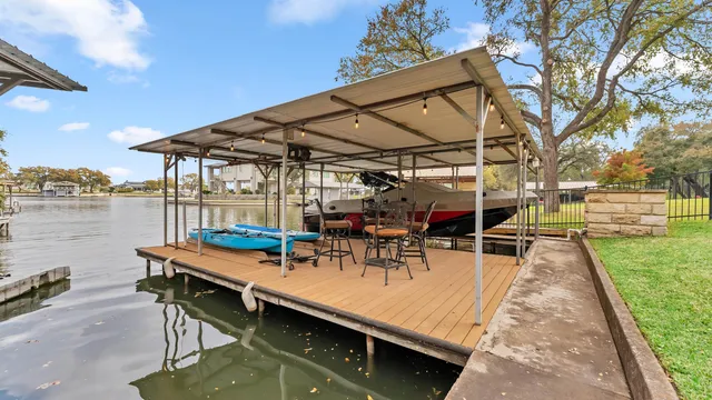 a view of a patio with swimming pool table and chairs