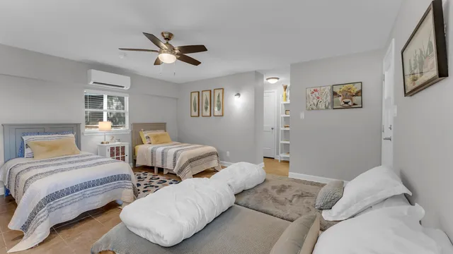 a bedroom with a bed and window