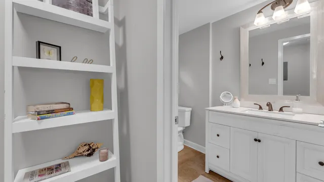a en suite bathroom with a sink and a mirror
