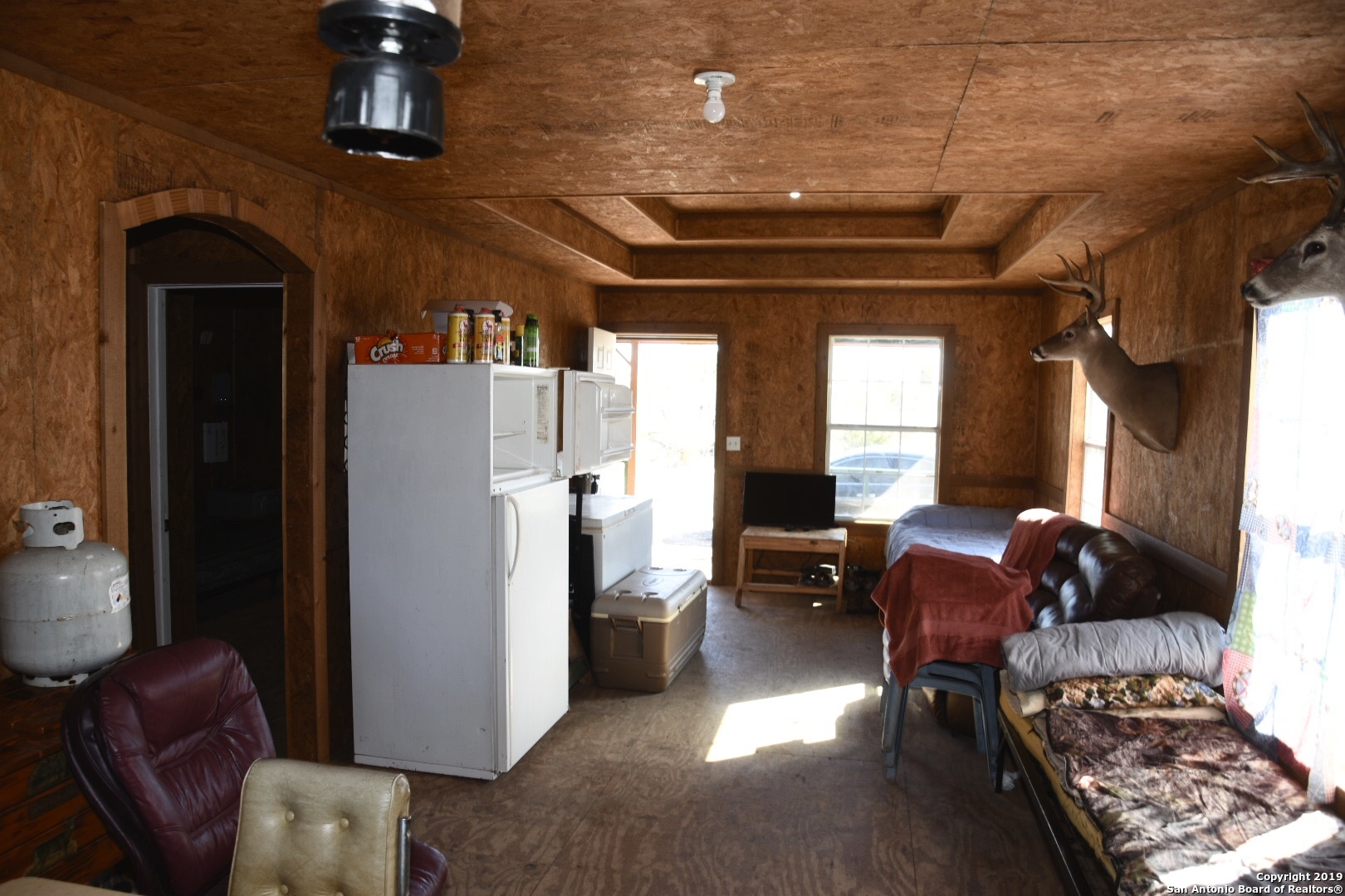 1052 Steep Road Del Rio, TX 78840 - Photo 19 of 25 a living room with furniture fireplace and windows