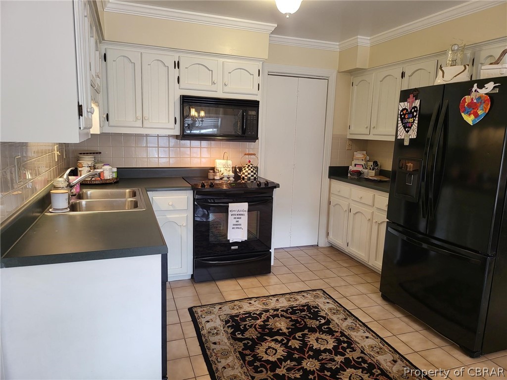 2449 Everglades Road Norfolk, VA 23518 - Photo 16 of 31 a kitchen with granite countertop a refrigerator stove and microwave