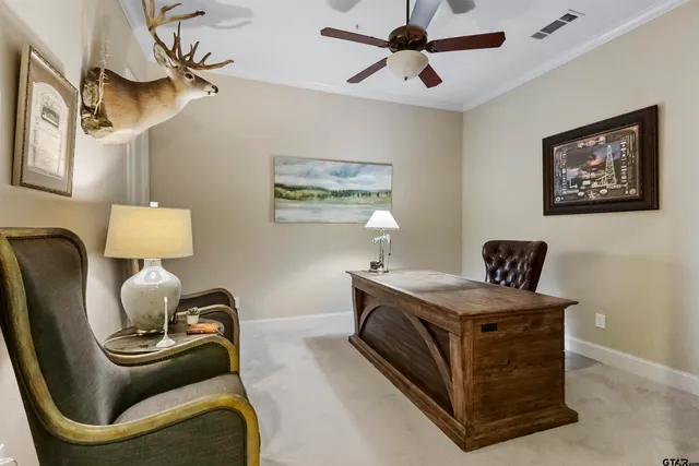 a bedroom with a bed chandelier and a window