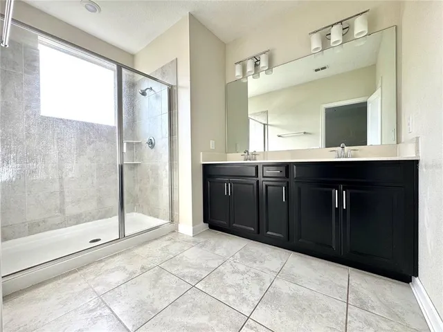 a kitchen with a sink and a refrigerator