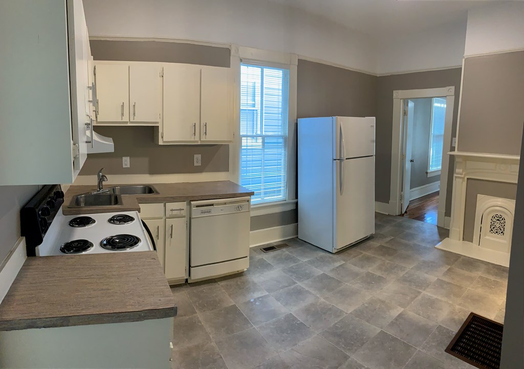 1360 Rhodes Street, Unit B Columbus, GA 31901 - Photo 8 of 14 a kitchen with a refrigerator and a stove