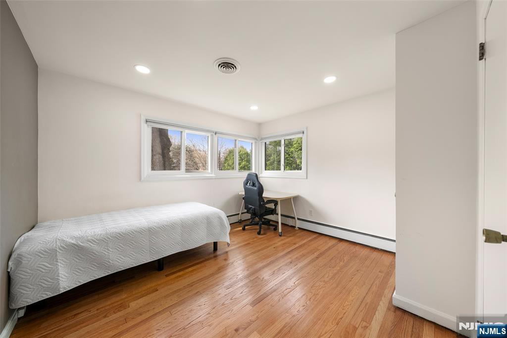 970 Soldier Hill Road Emerson, NJ 07630 - Photo 21 of 37 a bedroom with a bed and a window