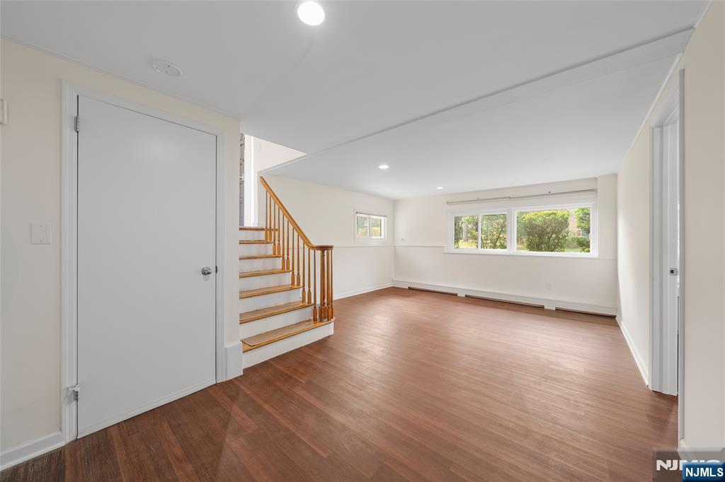 970 Soldier Hill Road Emerson, NJ 07630 - Photo 22 of 37 wooden floor in an empty room with a window