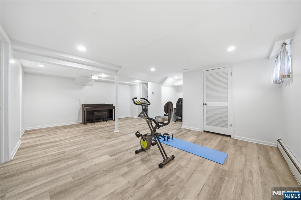 970 Soldier Hill Road Emerson, NJ 07630 - Photo 26 of 37 a view of a room with gym equipment and wooden floor