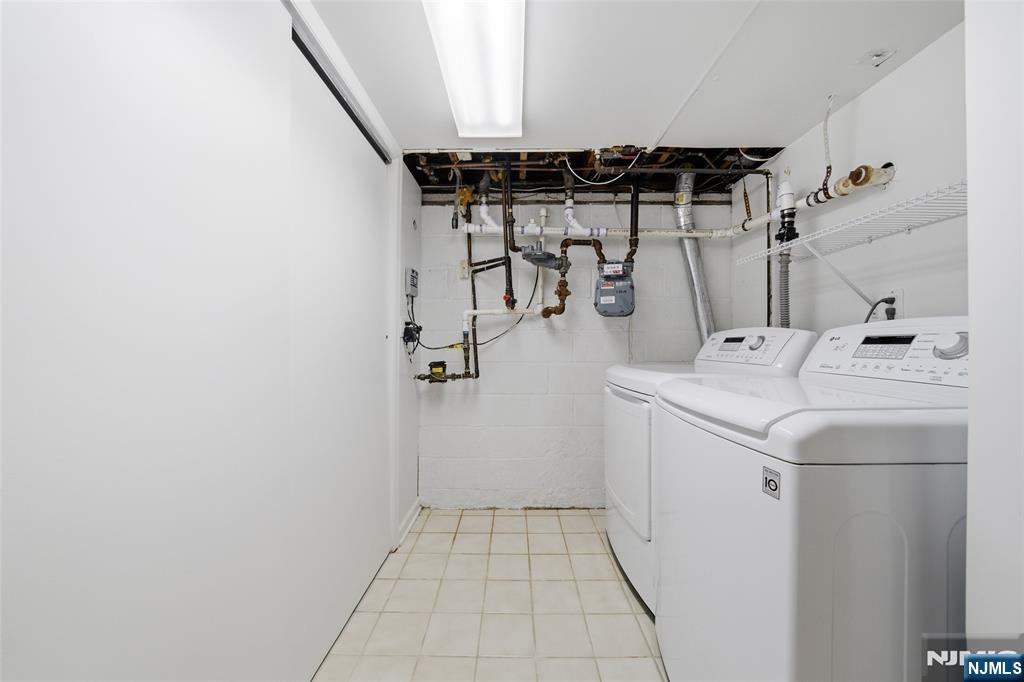 970 Soldier Hill Road Emerson, NJ 07630 - Photo 29 of 37 a utility room with dryer and washer