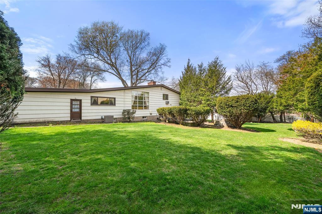 970 Soldier Hill Road Emerson, NJ 07630 - Photo 33 of 37 a front view of a house with a yard