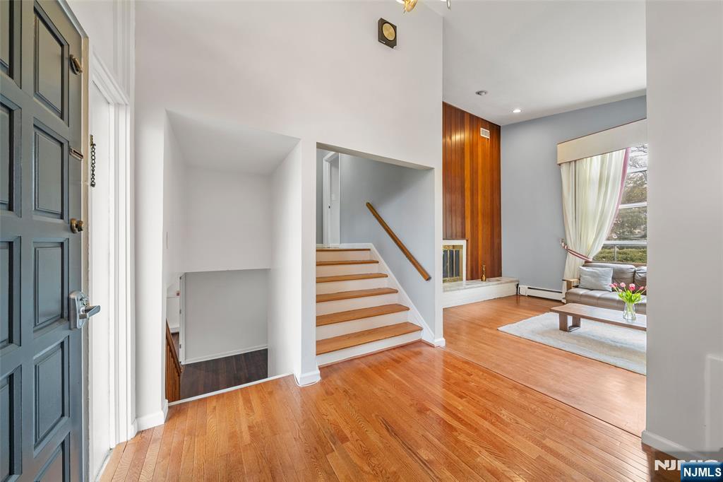 970 Soldier Hill Road Emerson, NJ 07630 - Photo 6 of 37 a view of an entryway with wooden floor and windows