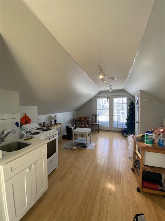 16 Fairfield Street, Unit 3 Cambridge, MA 02140 - Photo 1 of 6 a kitchen with sink cabinets and wooden floor