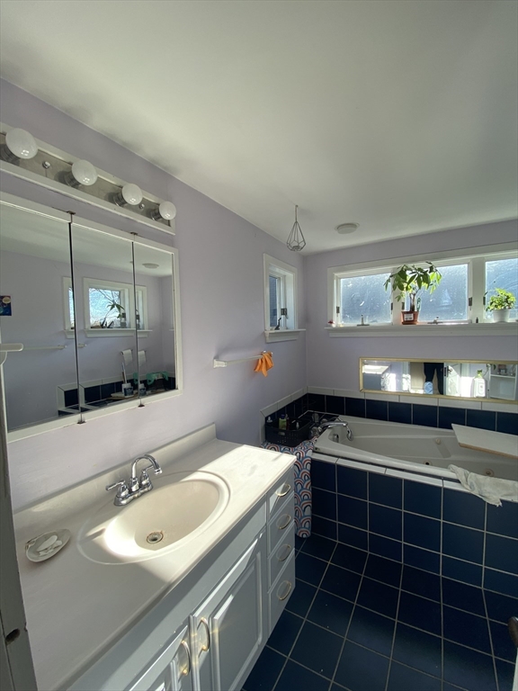 16 Fairfield Street, Unit 3 Cambridge, MA 02140 - Photo 4 of 6 a bathroom with a sink and a mirror