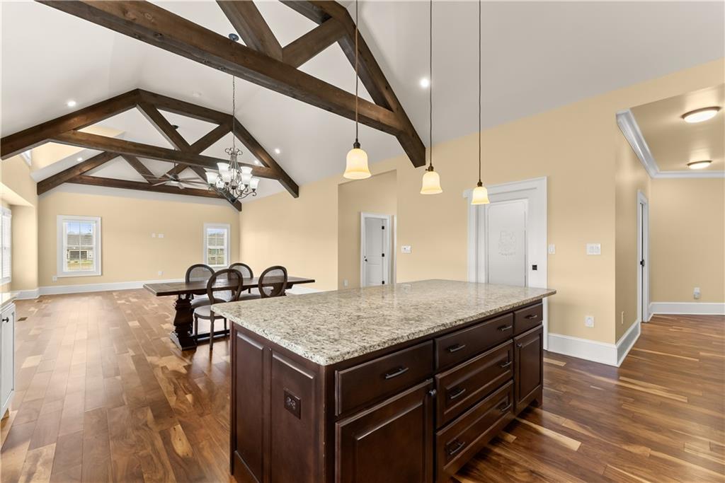 725 County Farm Road Jefferson, GA 30549 - Photo 22 of 66 a kitchen with a stove a sink and a wooden floor