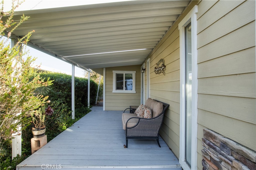 1595 Los Osos Valley Road, Unit 11A Los Osos, CA 93402 - Photo 2 of 31 a balcony with furniture and a potted plant