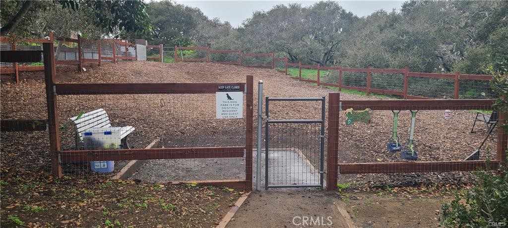 1595 Los Osos Valley Road, Unit 11A Los Osos, CA 93402 - Photo 25 of 31 a view of a wooden bench next to a yard
