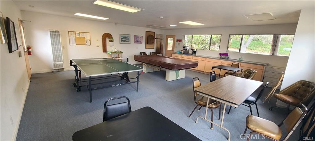 1595 Los Osos Valley Road, Unit 11A Los Osos, CA 93402 - Photo 29 of 31 a living room with furniture a rug and a large window
