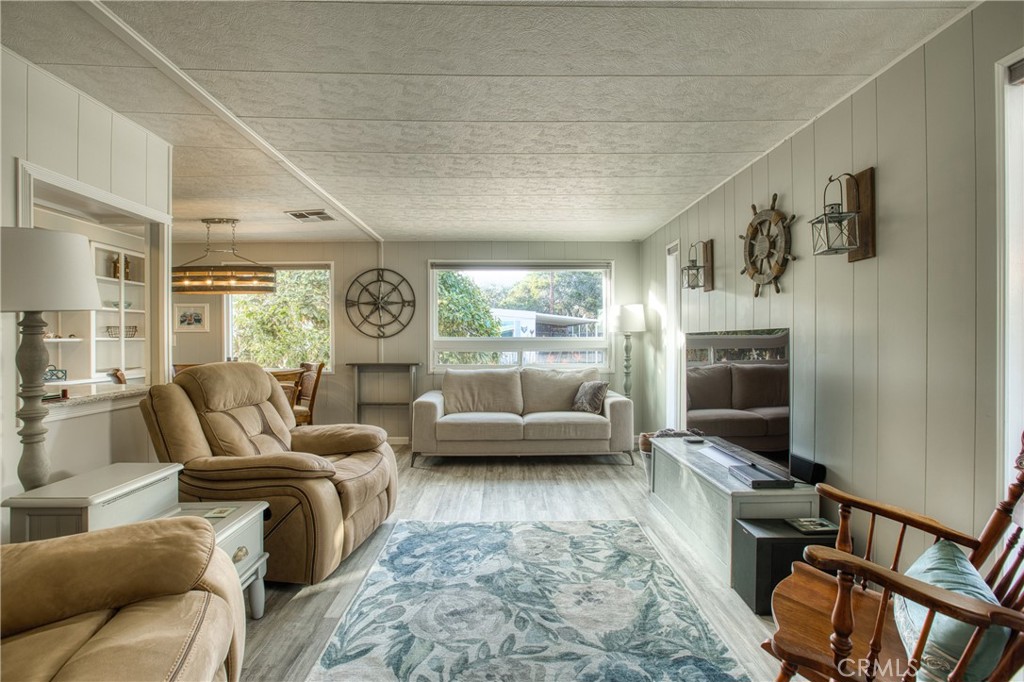 1595 Los Osos Valley Road, Unit 11A Los Osos, CA 93402 - Photo 5 of 31 a living room with furniture and a flat screen tv