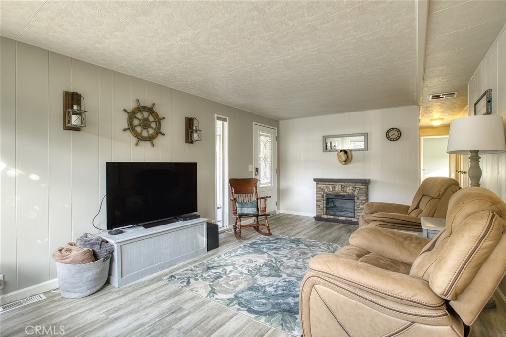 1595 Los Osos Valley Road, Unit 11A Los Osos, CA 93402 - Photo 6 of 31 a living room with furniture and a flat screen tv