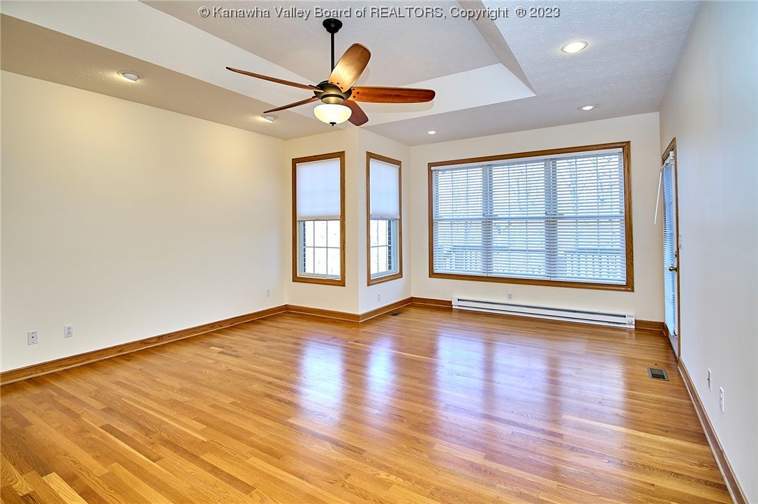 1625 Stonehenge Road Charleston, WV 25314 - Photo 23 of 50 Primary main level bedroom. The bedroom has access to enjoy your morning coffee with direct access to outdoor deck/living spaces. It also has a spacious primary bathroom and closet.