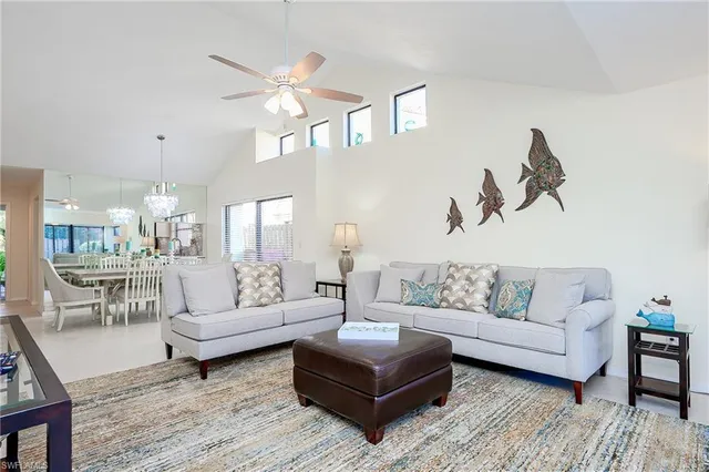 a living room with furniture and large window