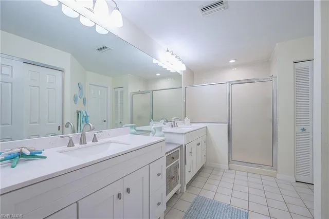 a bathroom with a shower and a tub