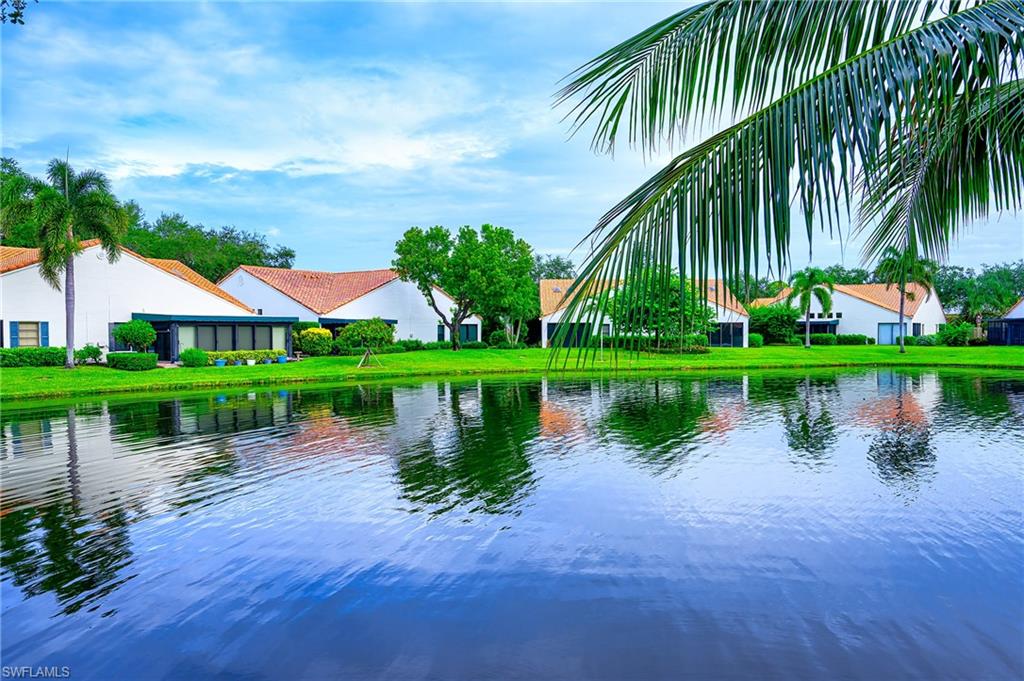 833 Reef Point Circle Naples, FL 34108 - Photo 31 of 41 Water view with nearby suburban area