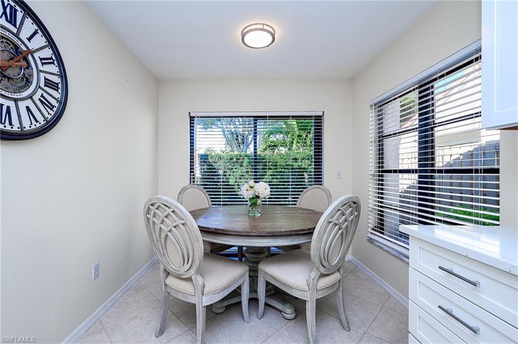 833 Reef Point Circle Naples, FL 34108 - Photo 6 of 41 Dining area with light tile patterned floors