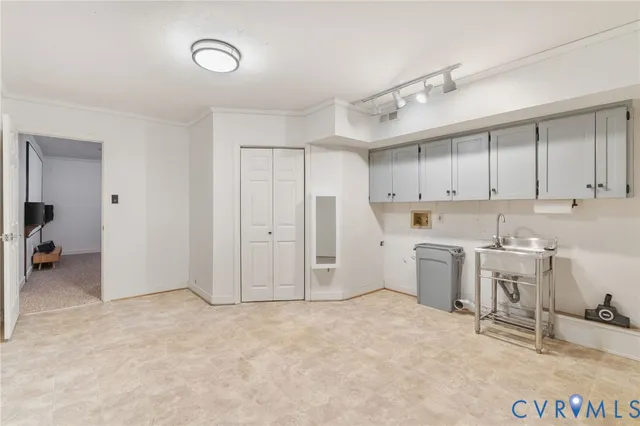 a view of a kitchen with refrigerator and cabinets