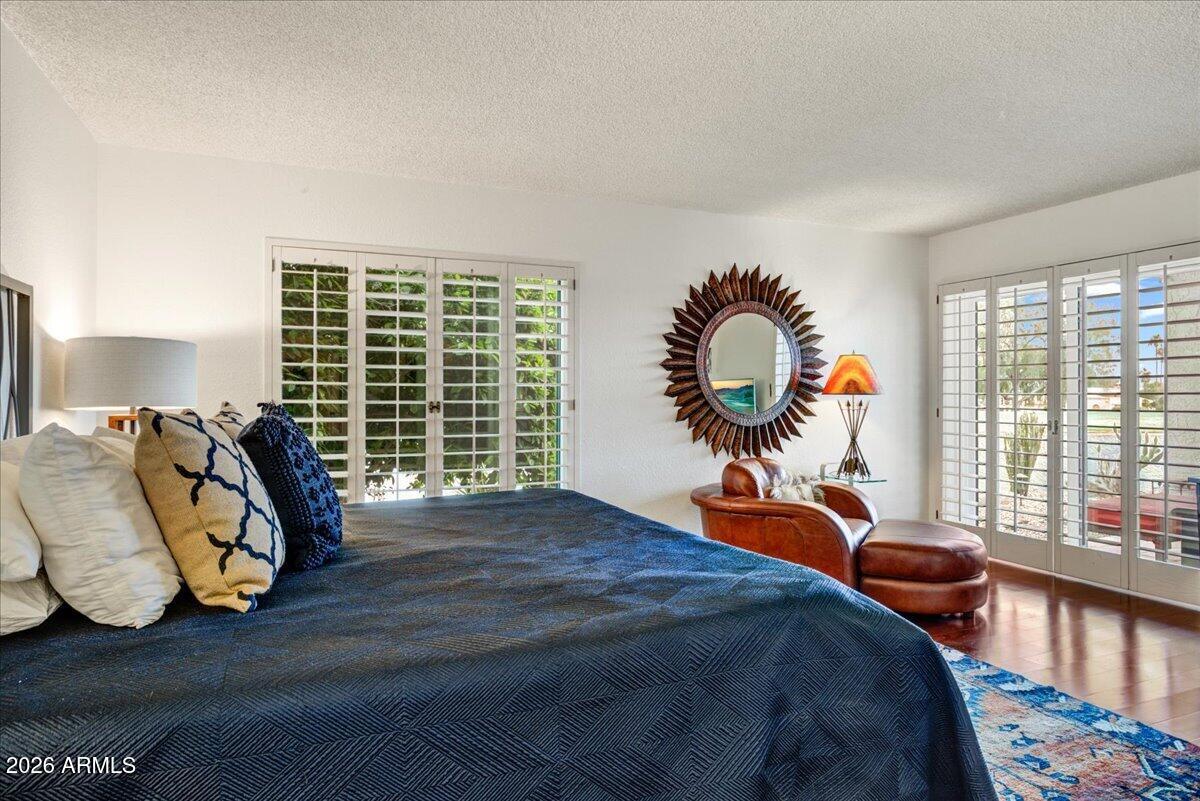 18810 East Chinle Drive Rio Verde, AZ 85263 - Photo 17 of 38 a bedroom with a bed and a large window