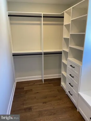 a bathroom with a double vanity sink toilet and shower