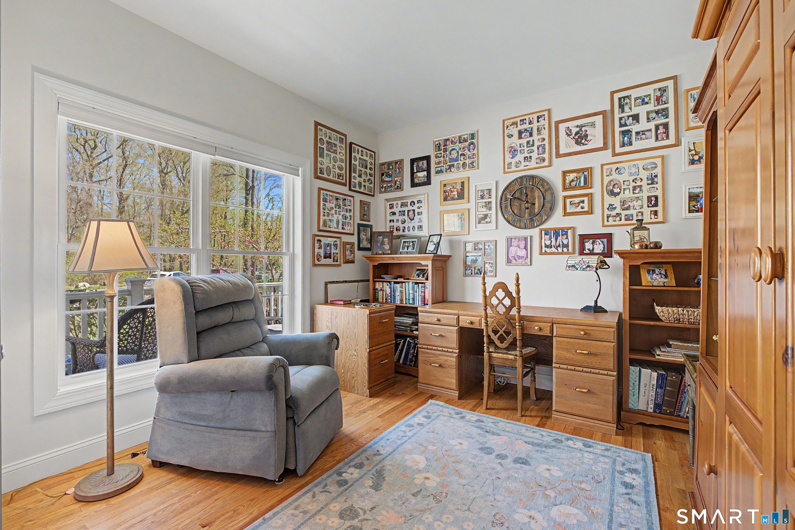 211 Meadowbrook Road, Unit 211 Oxford, CT 06478 - Photo 20 of 38 Versatile main-level bedroom currently set up as a home office, filled with natural light and offering a comfortable, inviting workspace.