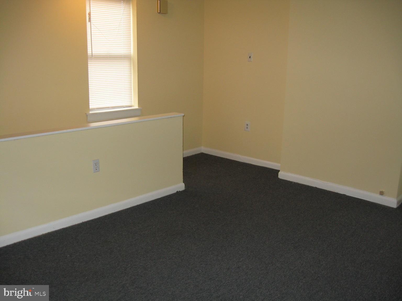 1048 South Street, Unit 3 Philadelphia, PA 19147 - Photo 7 of 9 an empty room with a window