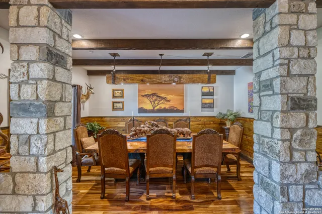 a view of a chairs and table in a room