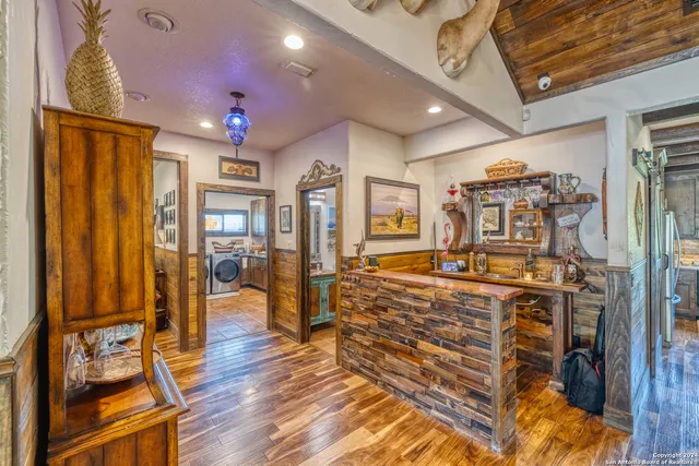 a view of a livingroom with furniture and a flat screen tv