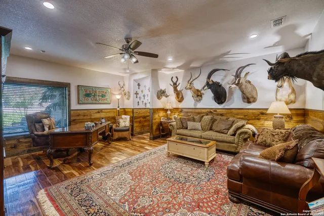 a living room with furniture and a rug